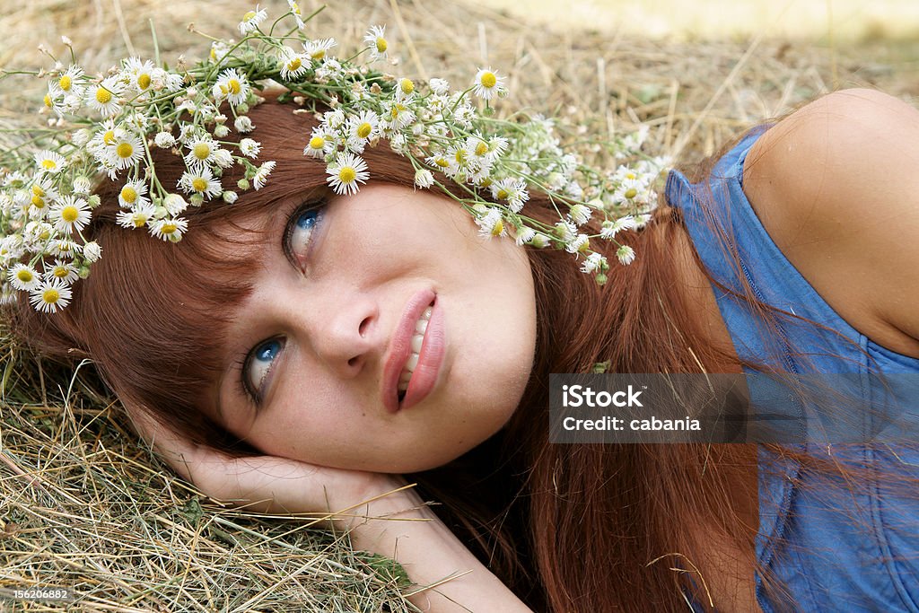 Girl in flower garland Beautiful cheerful girl in field flower garland outdoors 20-29 Years Stock Photo