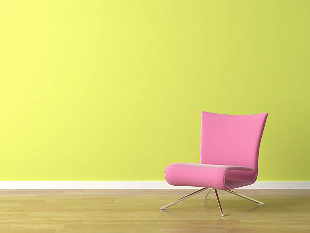 istock pink chair on green wall 156207829