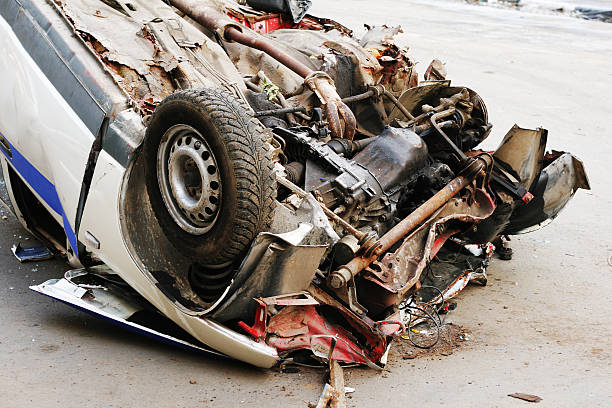 Small car with front accident damage on a carriage in Bangkok