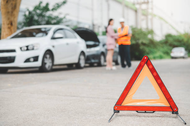 istock red emergency triangle on the road indicates that there is an accident or car breakdown on the road ahead. 1562095249