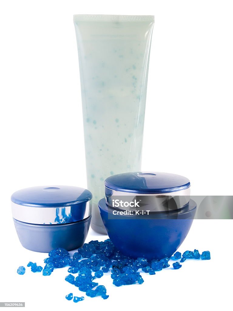 Crema solare e blu sale da bagno - Foto stock royalty-free di Bellezza