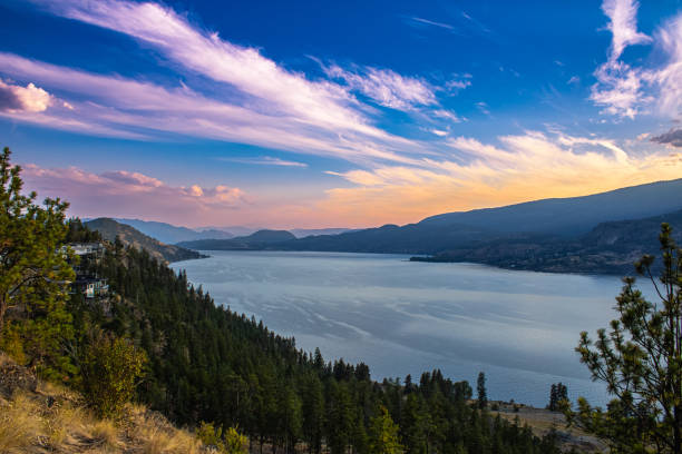 This gift shows us a magnificent sunset shining its colors on all of its surroundings. Taken by McKinley Landing, Kelowna BC, this view is facing southward down Okanagan Lake.