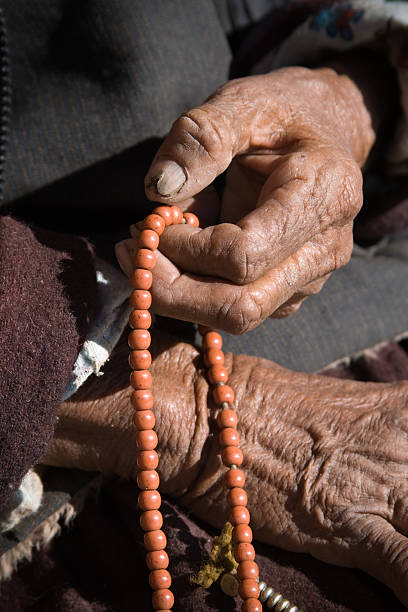 istock buddhist rosary beeds in old hand 156211688