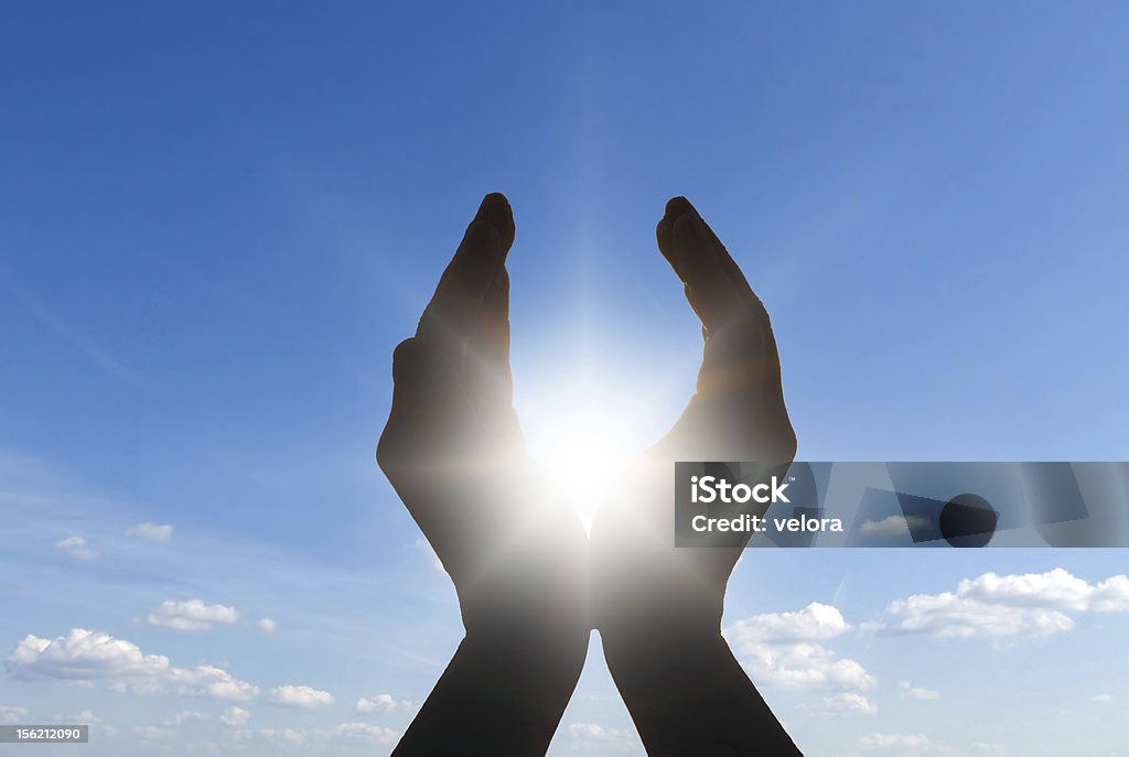 sun in hands hands holding the sun at dawn Sun Stock Photo