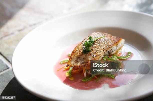 Grilled Fish With Garnish Over Vegetables Stock Photo - Download Image Now - Snapper Fish, Fillet, Cooked