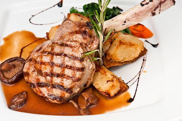 istock Veal chop on plate served with vegetables 156213157