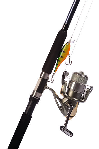 Fishing rod, reel with attached hard-bait isolated on white. selective focus. Close up.