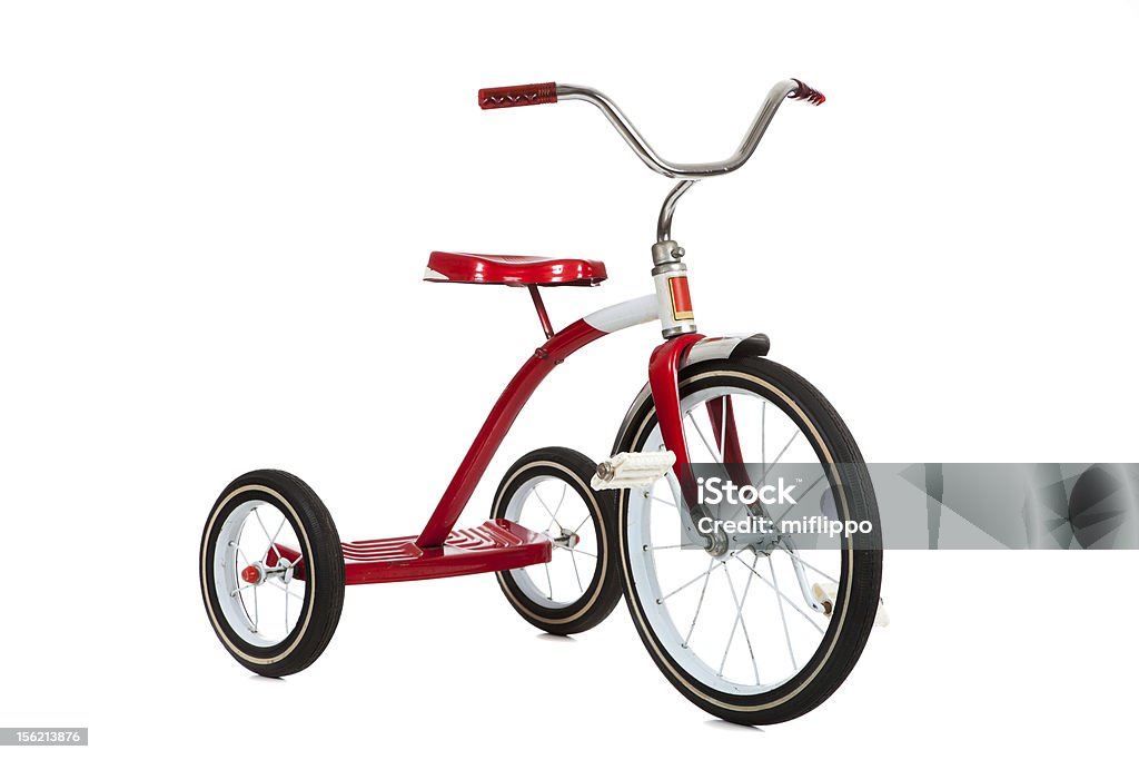 Vintage red tricycle isolated on white background A red toy tricycle on a white background with copy space Tricycle Stock Photo