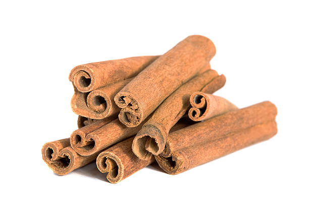 Cinnamon sticks on white background stock photo