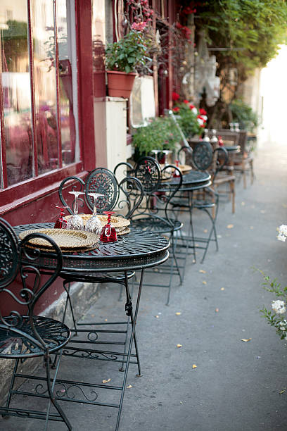istock Empty outdoor cafe tables and chairs in Paris 156214821
