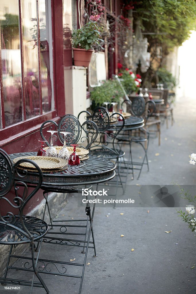 Empty outdoor cafe tables and chairs in Paris peaceful moment in paris Cafe Stock Photo
