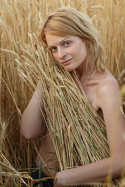 Woman and grain stock photo