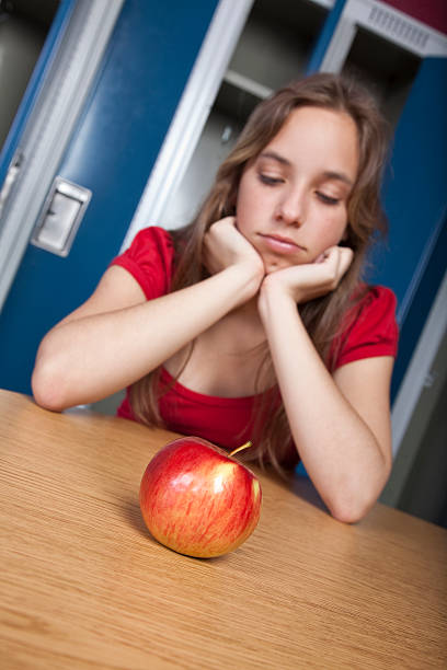 Teenage student contemplating lunch stock photo