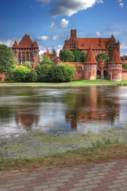 An HDR image of Malbork Teutonic Castle in portrait orientation.