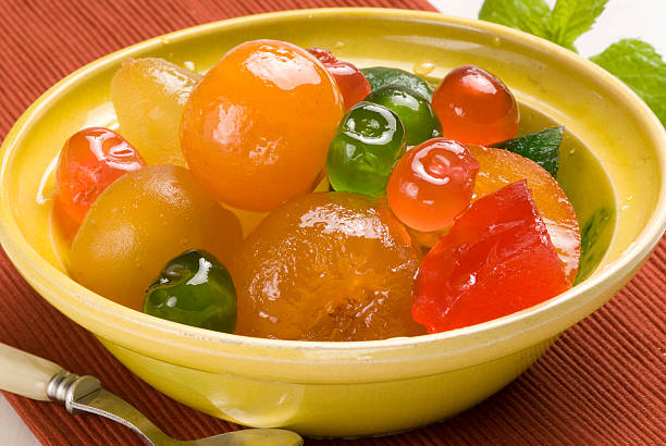 Candied fruits on a plate. stock photo