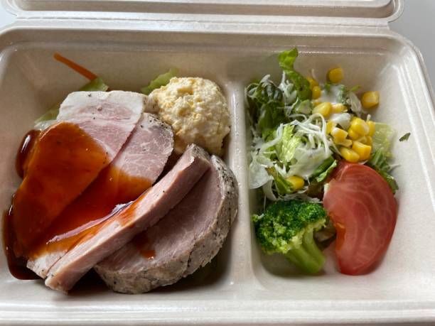 istock Roast pork with sauce and salad 1562183142
