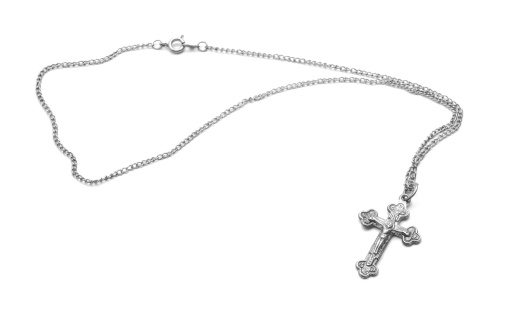 silver necklace with cross isolated on white