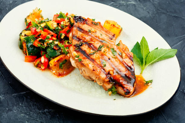 istock Tuna steak with grilled vegetables. 1562274261
