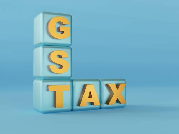istock GST and Tax Buzzword Cubes - Blue Background - 3D Rendering 1562306955