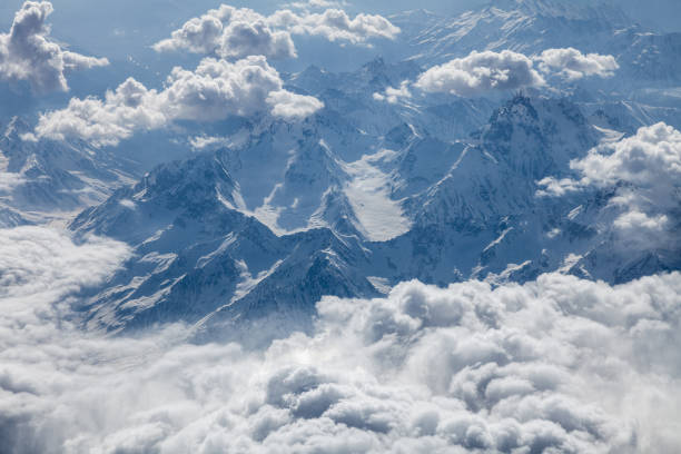 istock Majestic mountains under velvety clouds, aerial view 1562309028