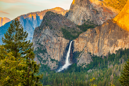 Bridalveil Falls flowing in afternoon light during record season snowmelt in 2023, Yosemite Valley, National Park, California, USA.