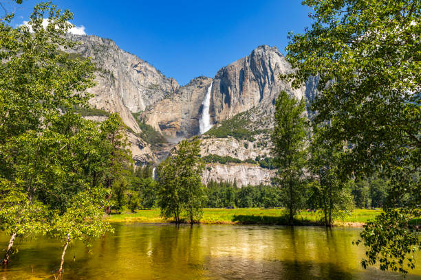 istock Yosemite Falls peak flow from snowmelt with reflection on still water 1562329106