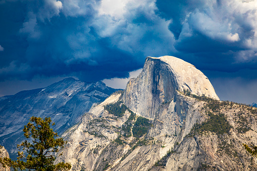 Storm forming over half dome in Yosemite National Park in summer, Yosemite Valley, National Park, California, USA.