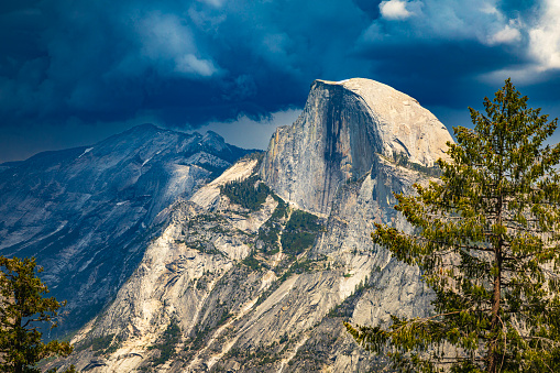 Storm forming over half dome in Yosemite National Park in summer, Yosemite Valley, National Park, California, USA.