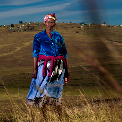 Xhosa woman (40-45 years old) standing in the grasslands outside Mthatha, city of Transkei, South Africa.