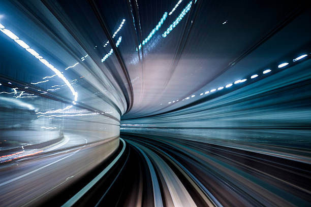 Tokyo Transit System Line Motion blur image of Tokyo Transit System Line by night - blur of motion of train through a tunnel. tokyo bullet train stock pictures, royalty-free photos & images