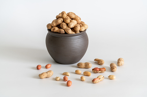 Cashew nuts in sack bag isolated on white background.