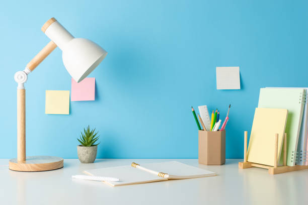 istock A side view photo of a study look with essential school items on a blue wall background. Empty space invites text or adverts 1562398198