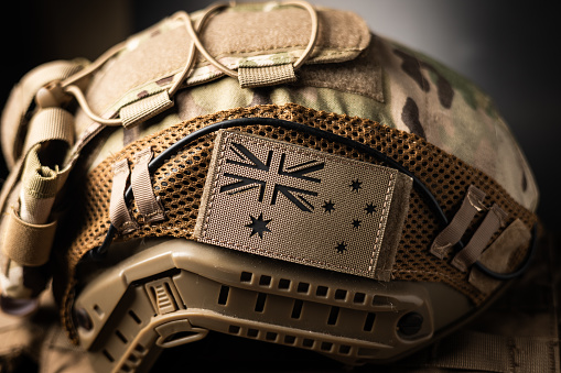 Tactical military special forces FAST helmet close up detail with Australia flag moral patch.