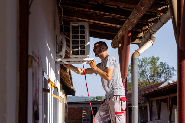 istock Installing the outdoor unit of air condition 1562433643