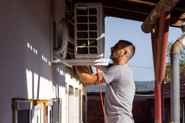 istock Installing the outdoor unit of air condition 1562435322