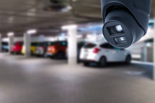 istock CCTV camera or surveillance system on indoor car parking. 1562445954