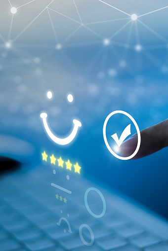 Businessman select smile icon for the best evaluation , customer satisfaction concept.