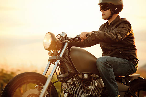 istock A man riding a motorcycle in the sunset 156249964