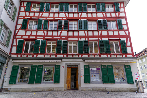 Facade of historic frame house at the old town of Swiss City of Winterthur on a cloudy spring day. Photo taken May 17th, 2023, Winterthur, Switzerland.