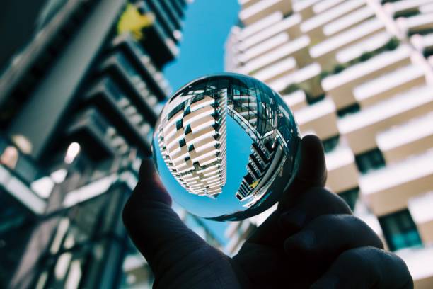 istock Crystal ball against modern buildings 1562580962