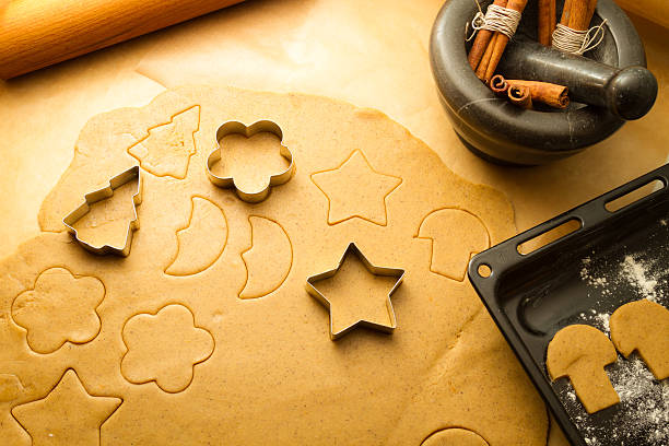 istock Cutting Christmas cookies made of gingerbread 156258439
