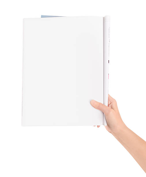 istock Hand holding blank magazine page 156260658