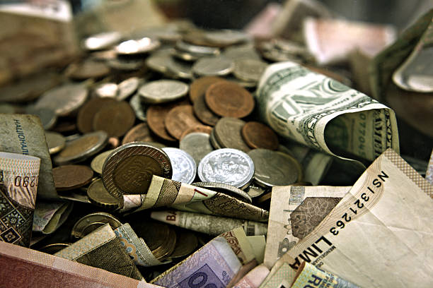 International Money in Big Cash and Forex Coins stock photo