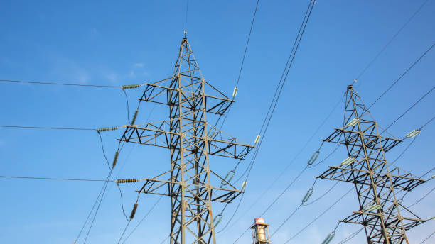 istock power line support with wires for electricity transmission. High voltage grid tower with wire cable at distribution station. Energy industry. 1562619501