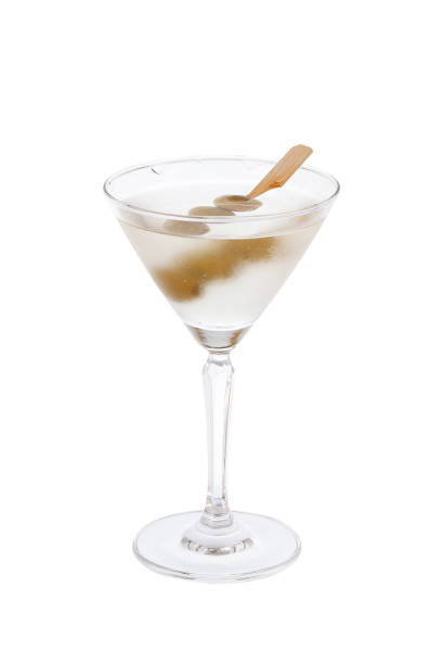 istock Martini cocktail with olives in a glass isolated on white background. 1562638143
