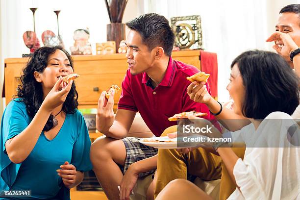 Asian People Eating Pizza At Party Stock Photo - Download Image Now - Adult, Arts Culture and Entertainment, Asia