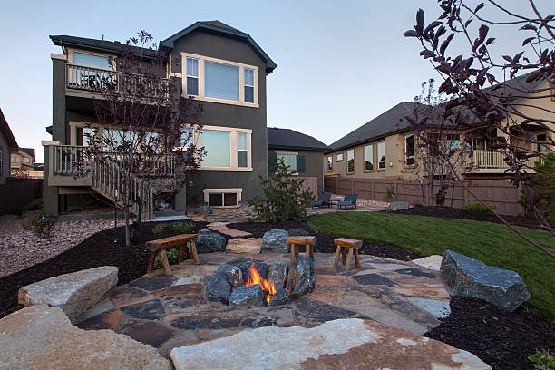 Landscaped backyard with beautiful Fire pit stock photo