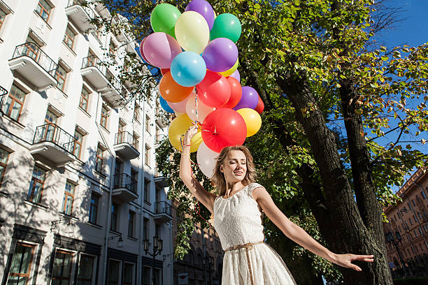 istock woman with balloons 156268148