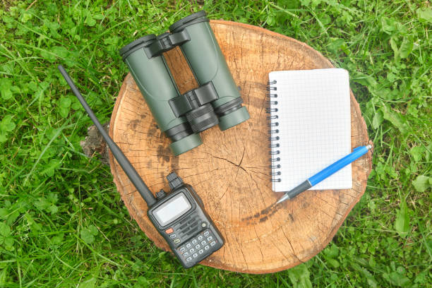 istock military binoculars, professional outdoor walkie-talkie, notepad, notebook 1562691585