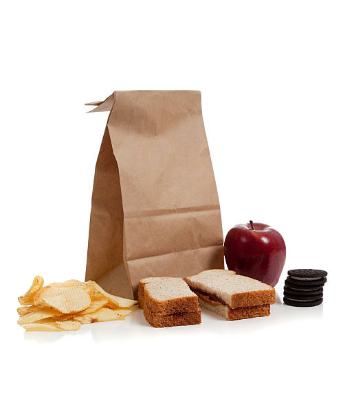 мешок обеда с арахисовым маслом и фруктовым джемом - lunch bag apple brown стоковые фото и изображения